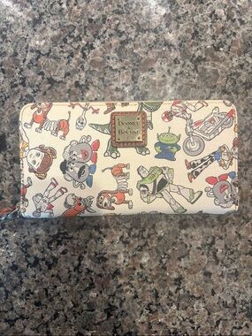 Dooney & Bourke Cream Toy Story Character Zip Wallet